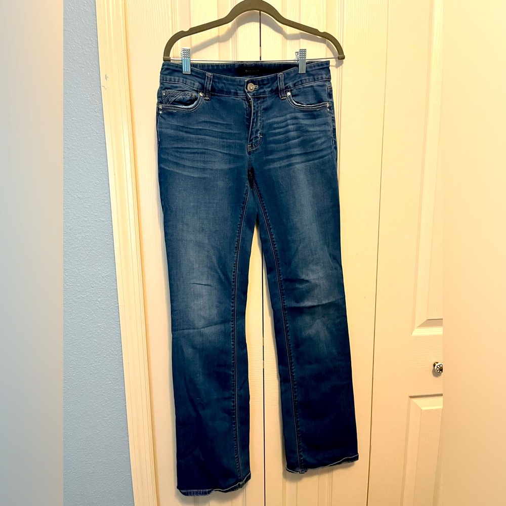 WHBM boot cut jeans size 4 medium wash with a rhinestone detail
